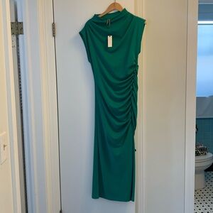 New with tags on Beautiful emerald green calve length dress.
